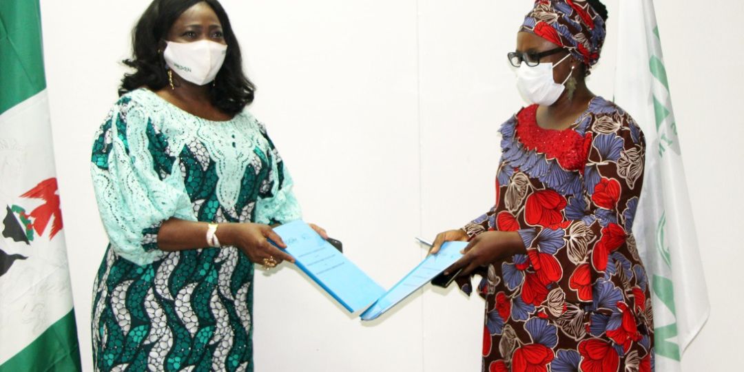 Chairman/CEO, Nigerians in Diaspora Commission, (NiDCOM) Hon Abike Dabiri-Erewa and Chairperson, Nigeria Diaspora Summit Initiative (NDSI) Dr Badewa Adejugbe-Williams with Copies of MoU recently signed in Abuja