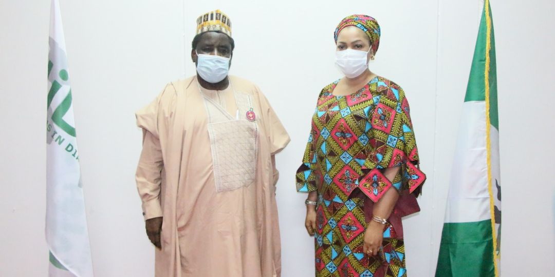 L-R: Engr (Dr) Sule Yakubu Bassi, Secretary, Nigerians in Diaspora Commission (NIDCOM) receiving the newly appointed Kogi state Diaspora Focal Point Officer, Mrs Medina Nene Anako in NIDCOM Headquarters Abuja on Monday