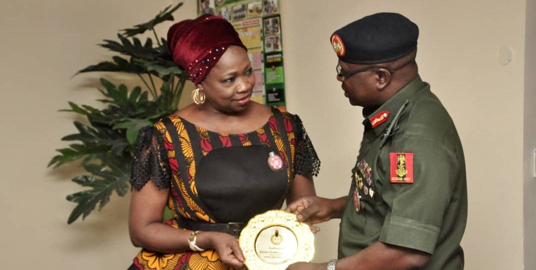 Hon. Abike Dabiri-Erewa Chairman/CEO NIDCOM receiving an NYSC souvenir from the DG NYSC Brig. Gen. Shuaibu Ibrahim in Abuja recently.