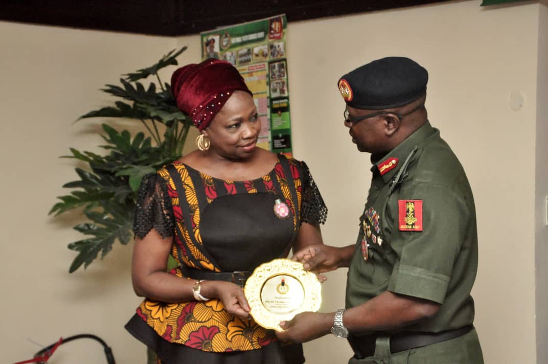 Hon. Abike Dabiri-Erewa Chairman/CEO NIDCOM receiving an NYSC souvenir from the DG NYSC Brig. Gen. Shuaibu Ibrahim in Abuja recently.