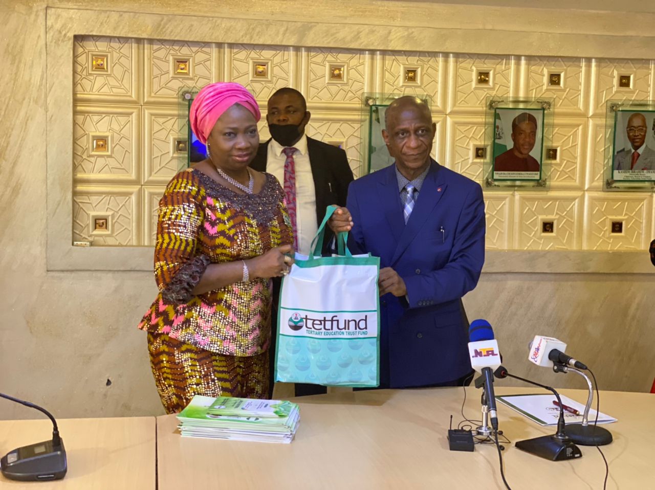 HON. Abike Dabiri-Erewa , Chairman/CEO, NIDCOM and Prof. Sulaiman Elias Bogoro exchanging Sourvenirs when the latter received NIDCOM delegation in his Maitama office in Abuja.